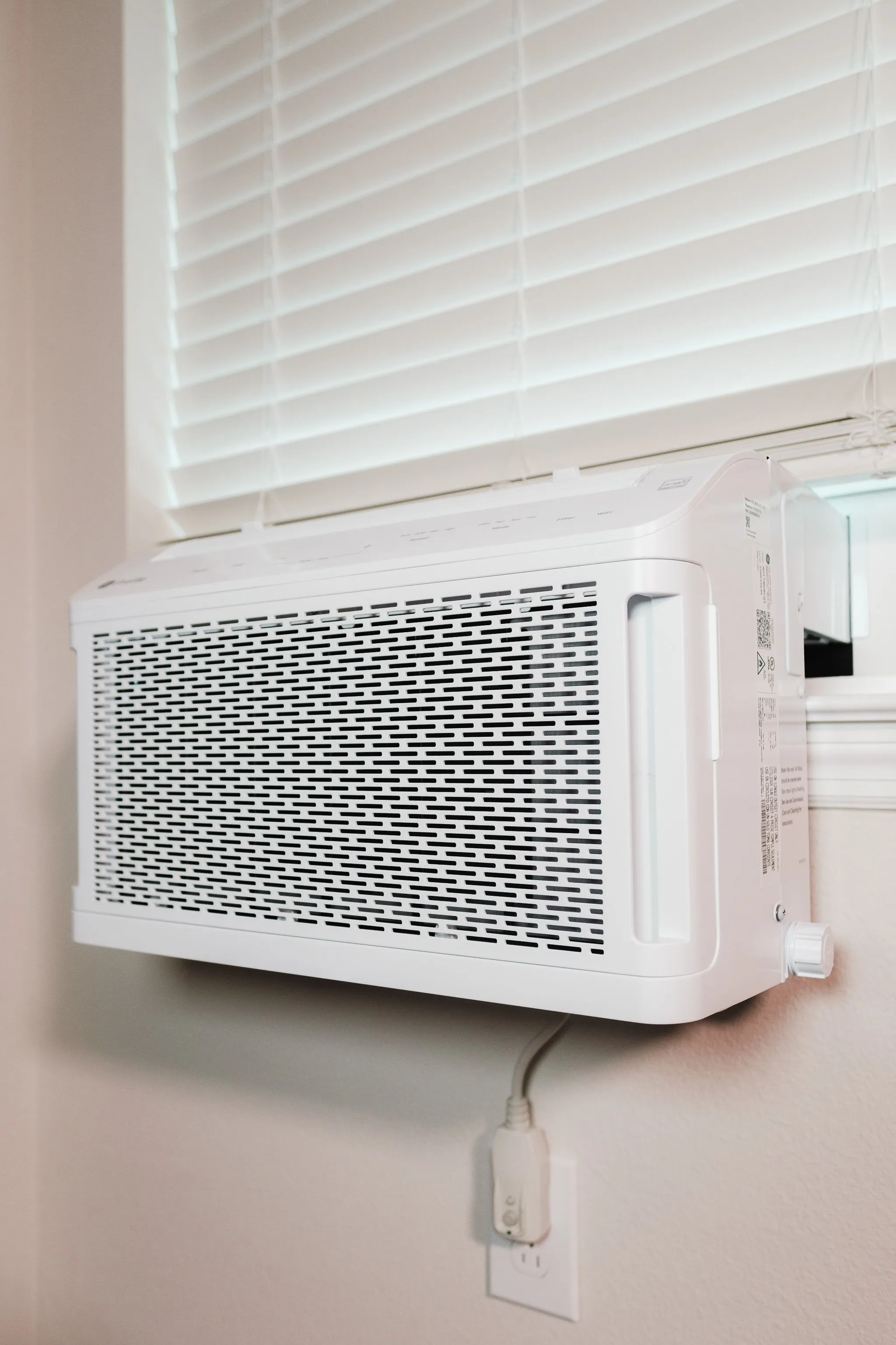 Rojas technician servicing an air conditioning unit